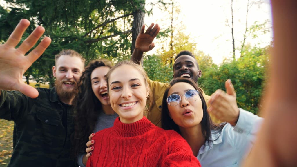 Friends taking a selfie outdoors